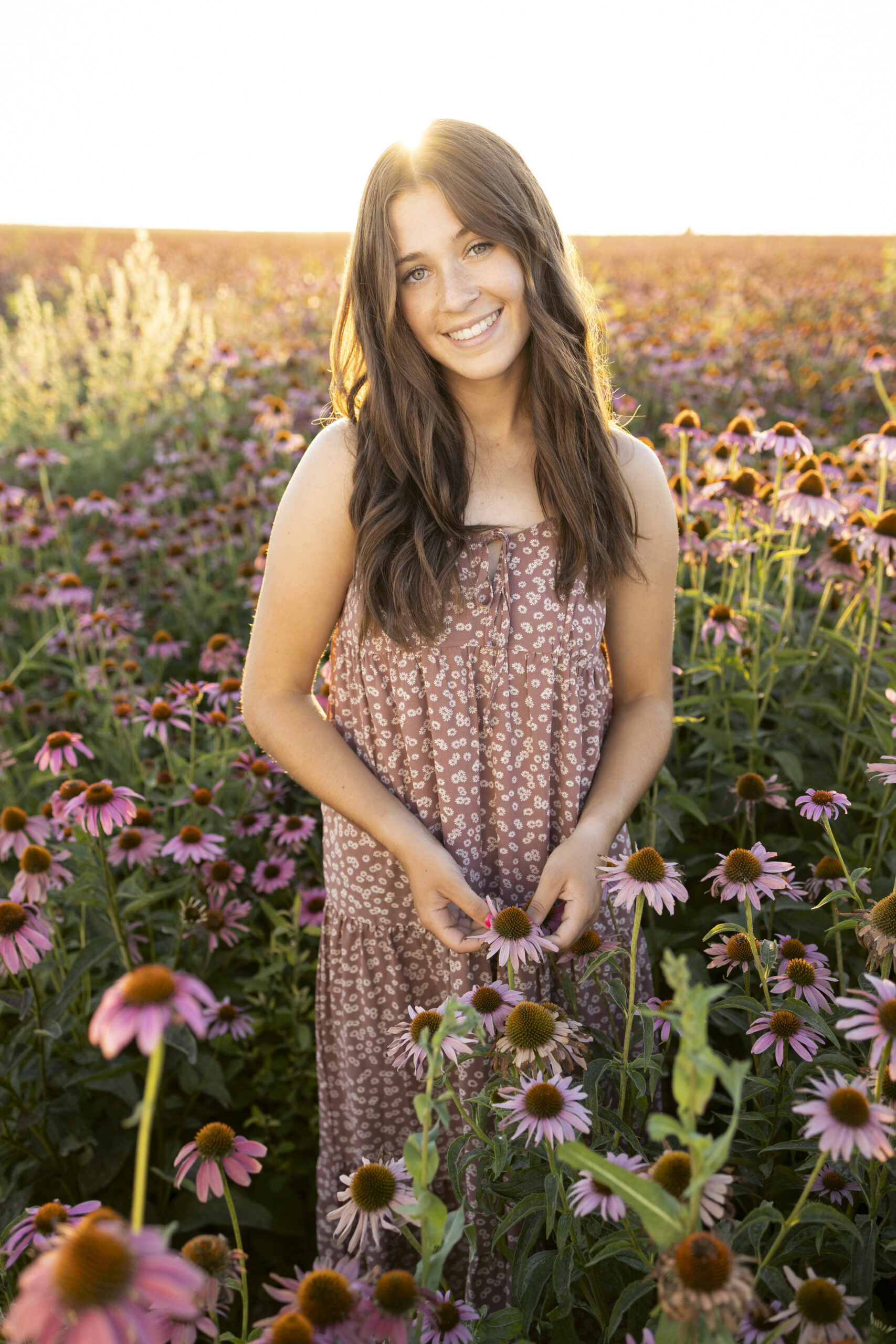 outdoor flower field senior pictures with Michelle Nichols Photography in Nampa
